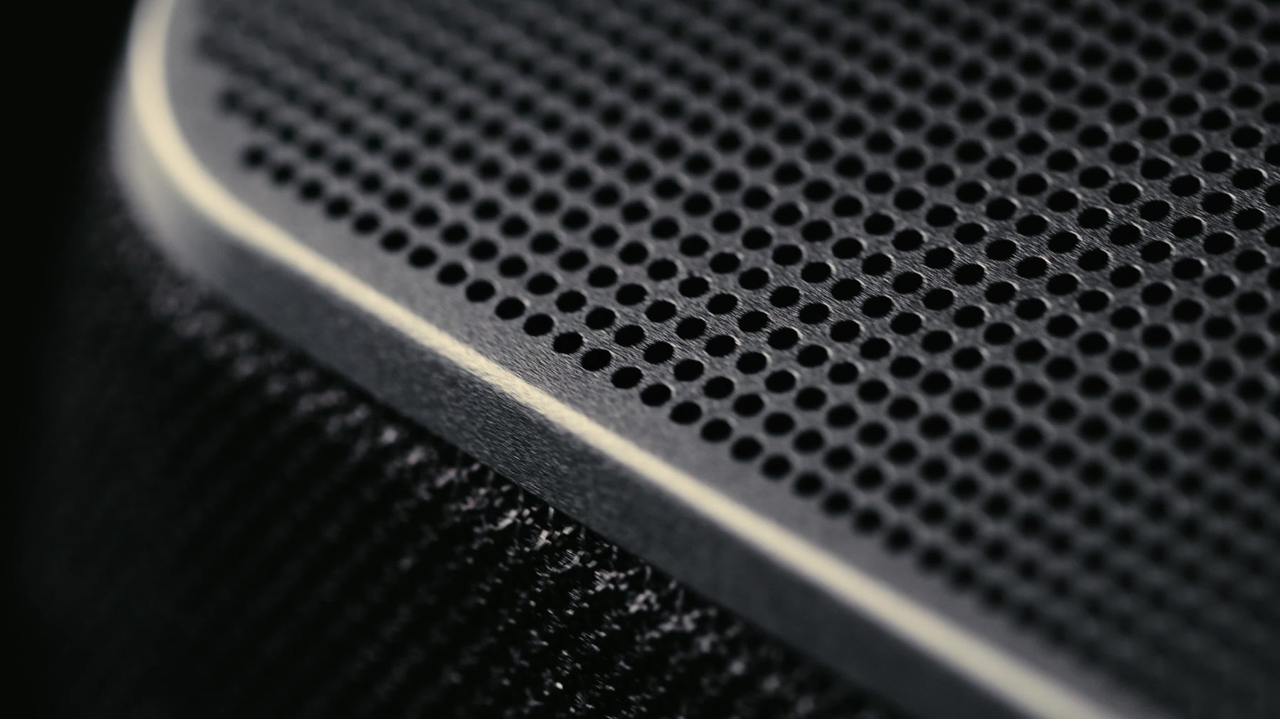 Custom Shopify theme vs template: close-up of a premium loudspeaker grille and trim