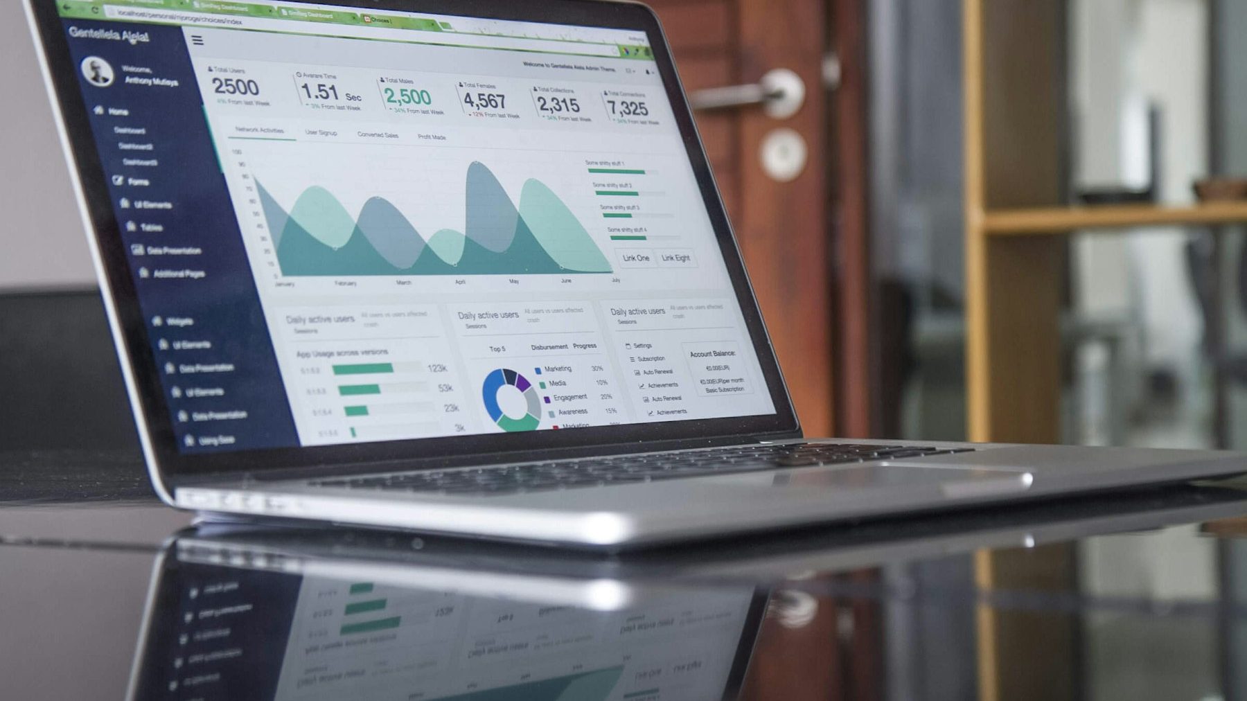 PrestaShop to Shopify migration: a laptop on a glass-top table