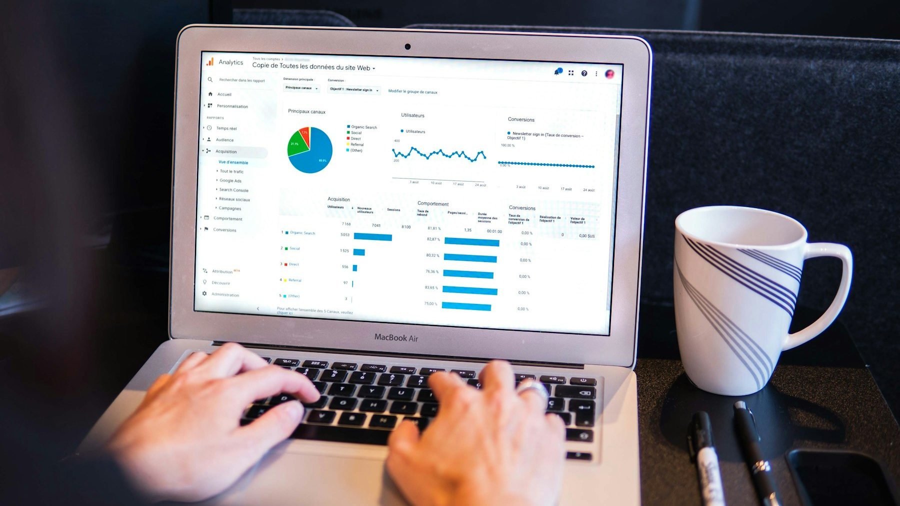 Shopify to Shopify migration: a person using a laptop on a black table