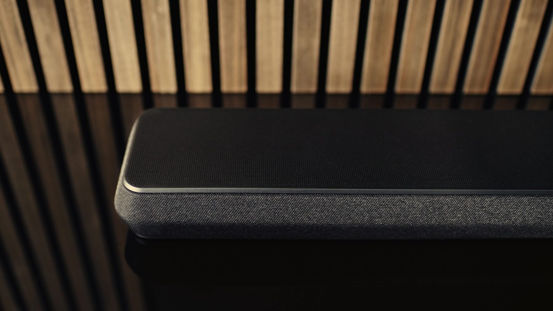 WooCommerce to Shopify migration: close-up of a premium soundbar on a dark media unit